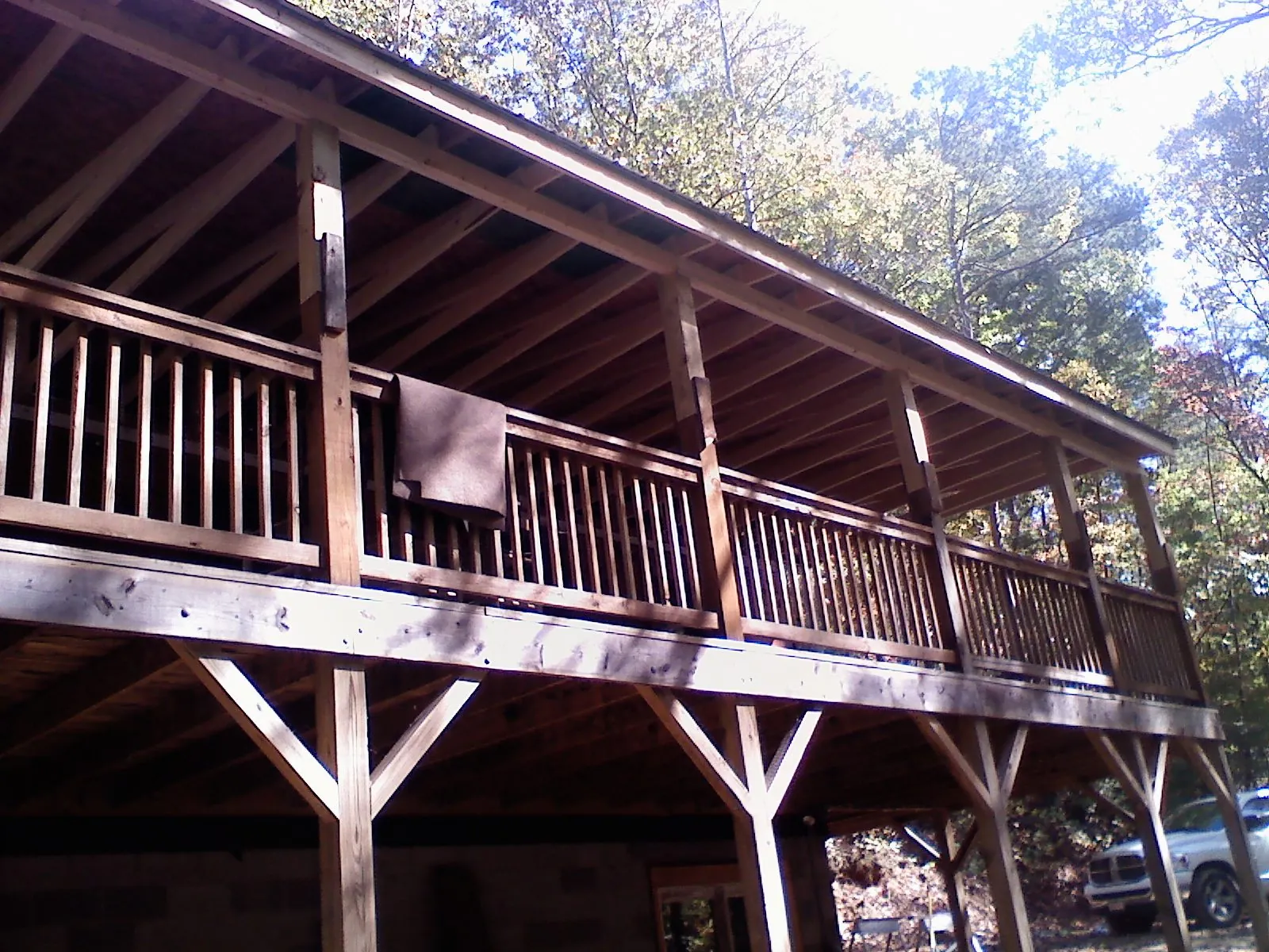 Timber framing under a new elevated porch and deck — Roof Leak Repair in Chippewa Lake by Roofing Brothers